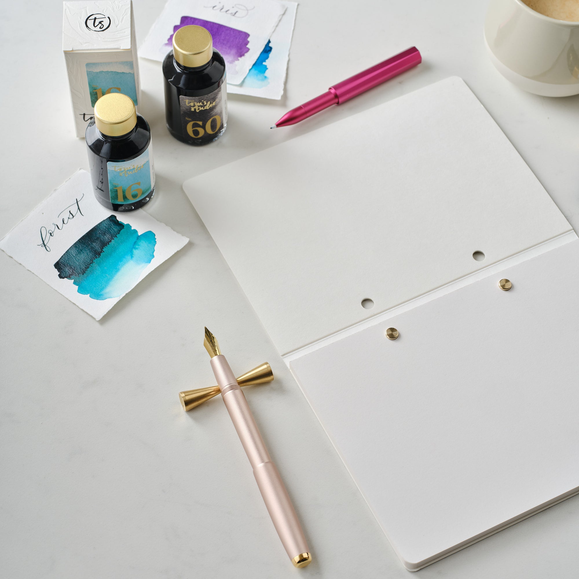 The Studio Pad in White – a refillable, customisable notebook and organiser on a desk setup