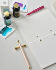 The Studio Pad in White – a refillable, customisable notebook and organiser on a desk setup