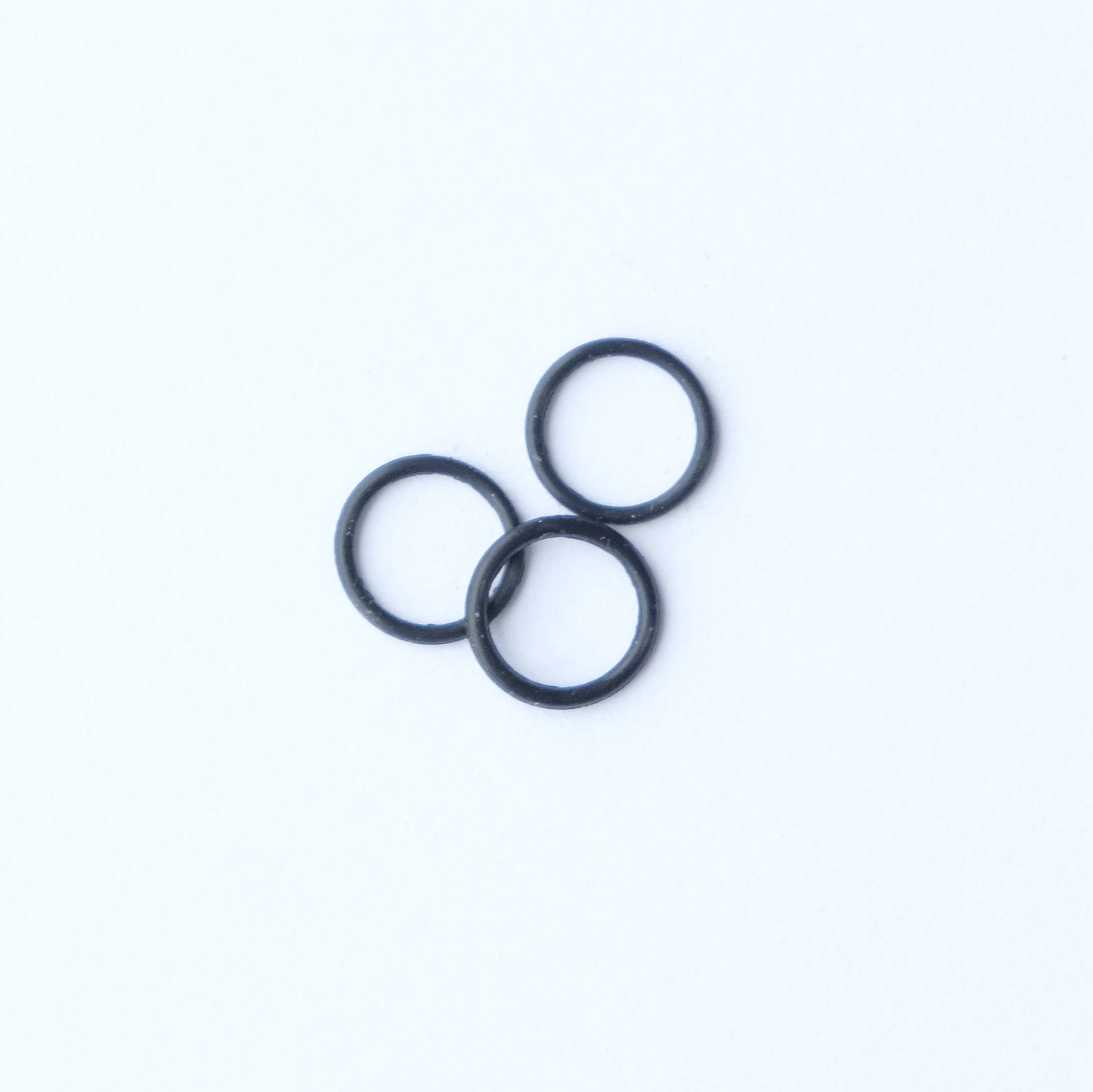 3 black rubber o ring components displayed on a white background