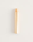 Brass Wren pen capped on a light background.