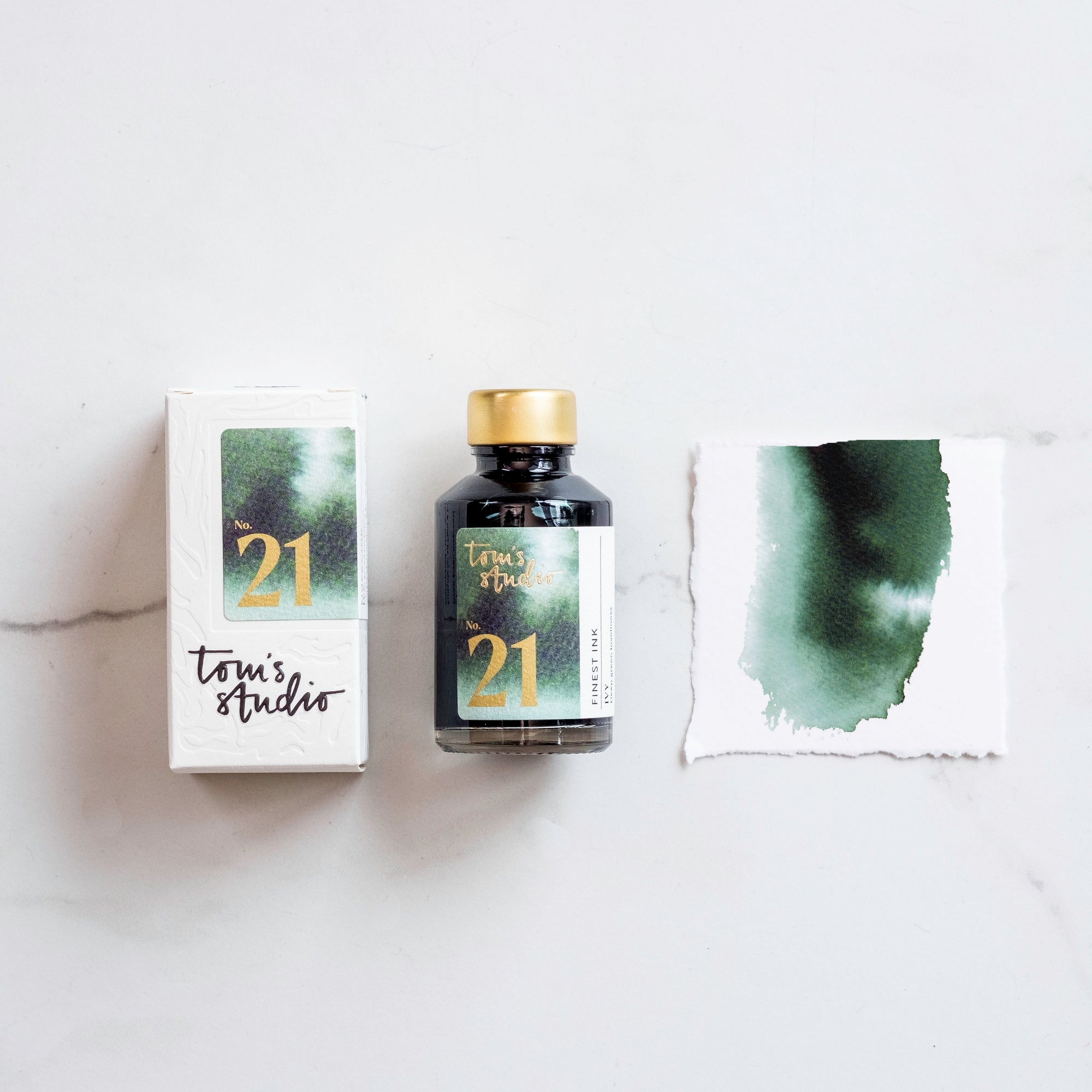 Tom's Studio Ivy green Fountain Pen Ink – featuring the packaging, bottle and a swatch on paper