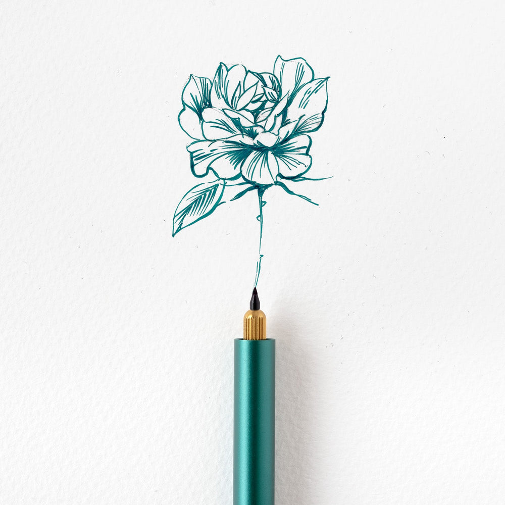 An example of a rose illustration created using the Detail Brush Tip in the Lumos, in Marianas blue/green fountain pen ink