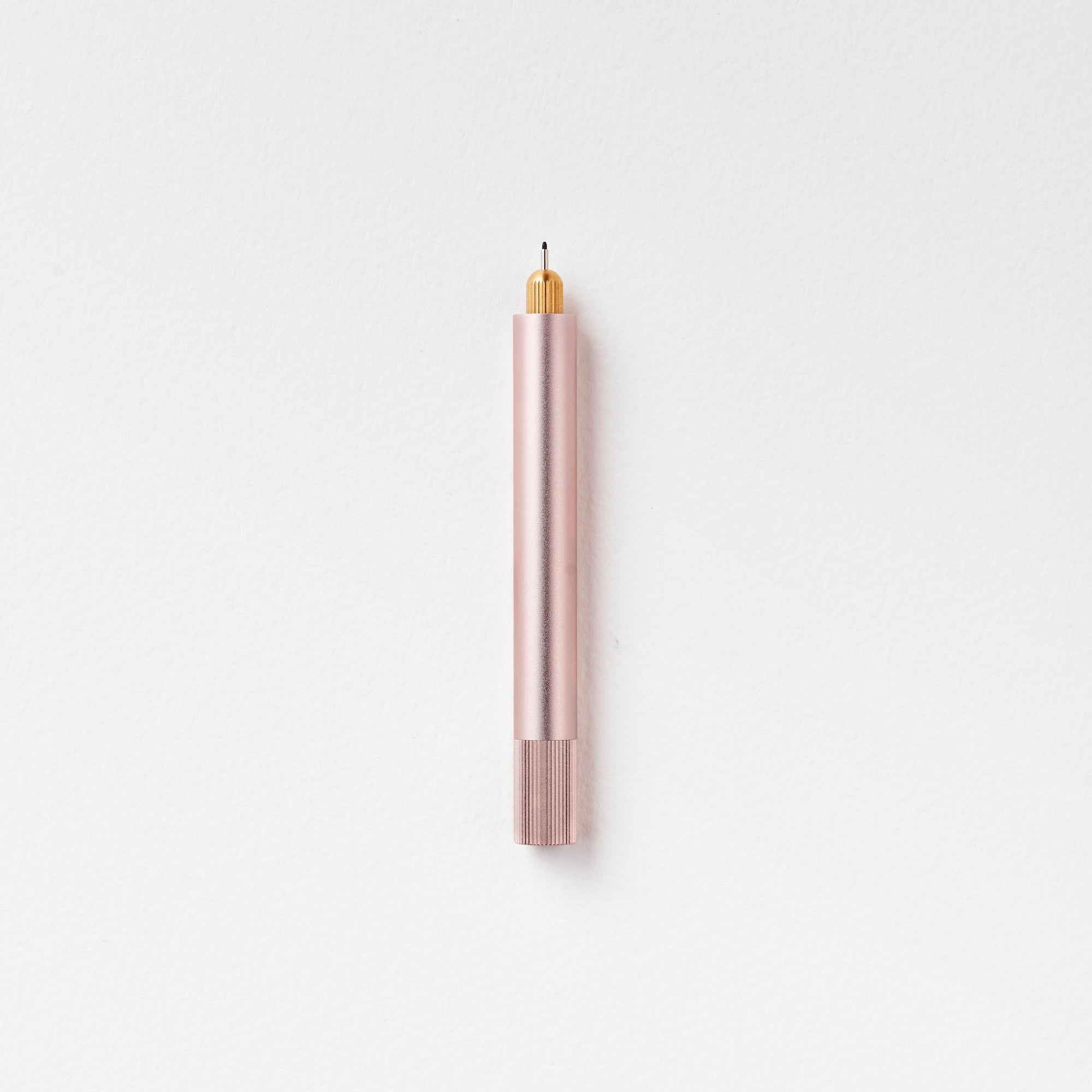 The Lumos Mini Refillable Pen in Blush on white background