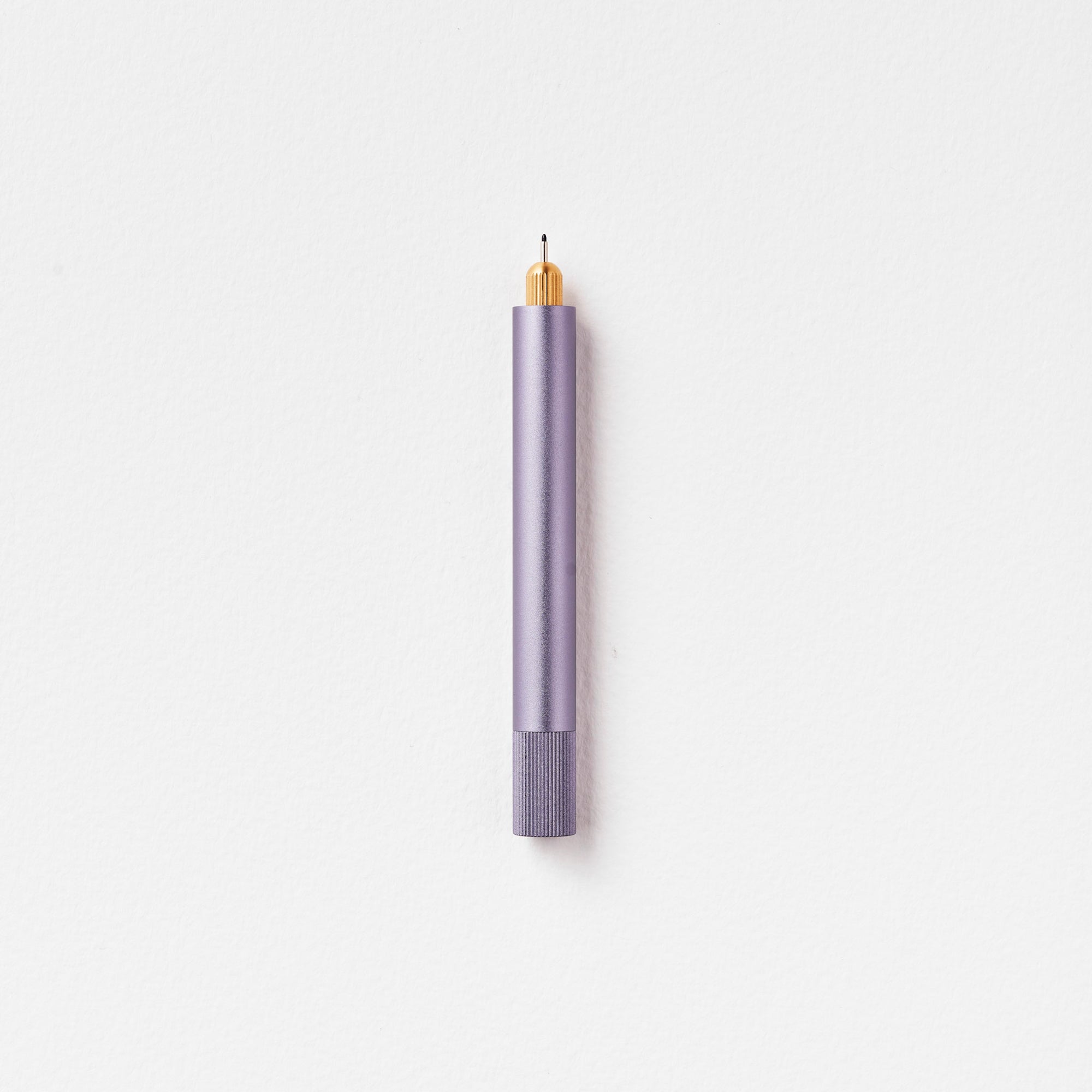 The Lumos Mini Refillable Pen in Lilac on white background