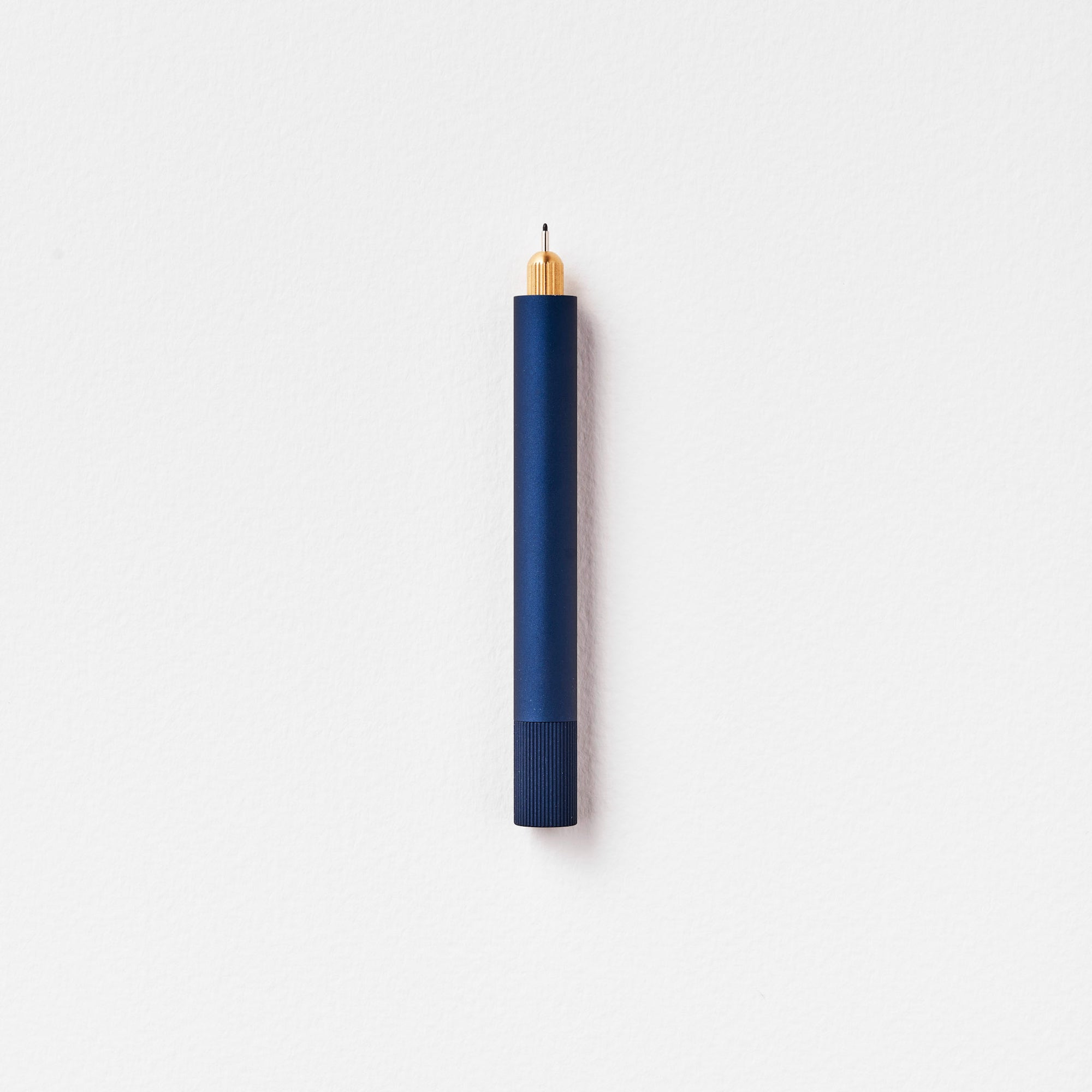 The Lumos Mini Refillable Pen in Midnight on white background