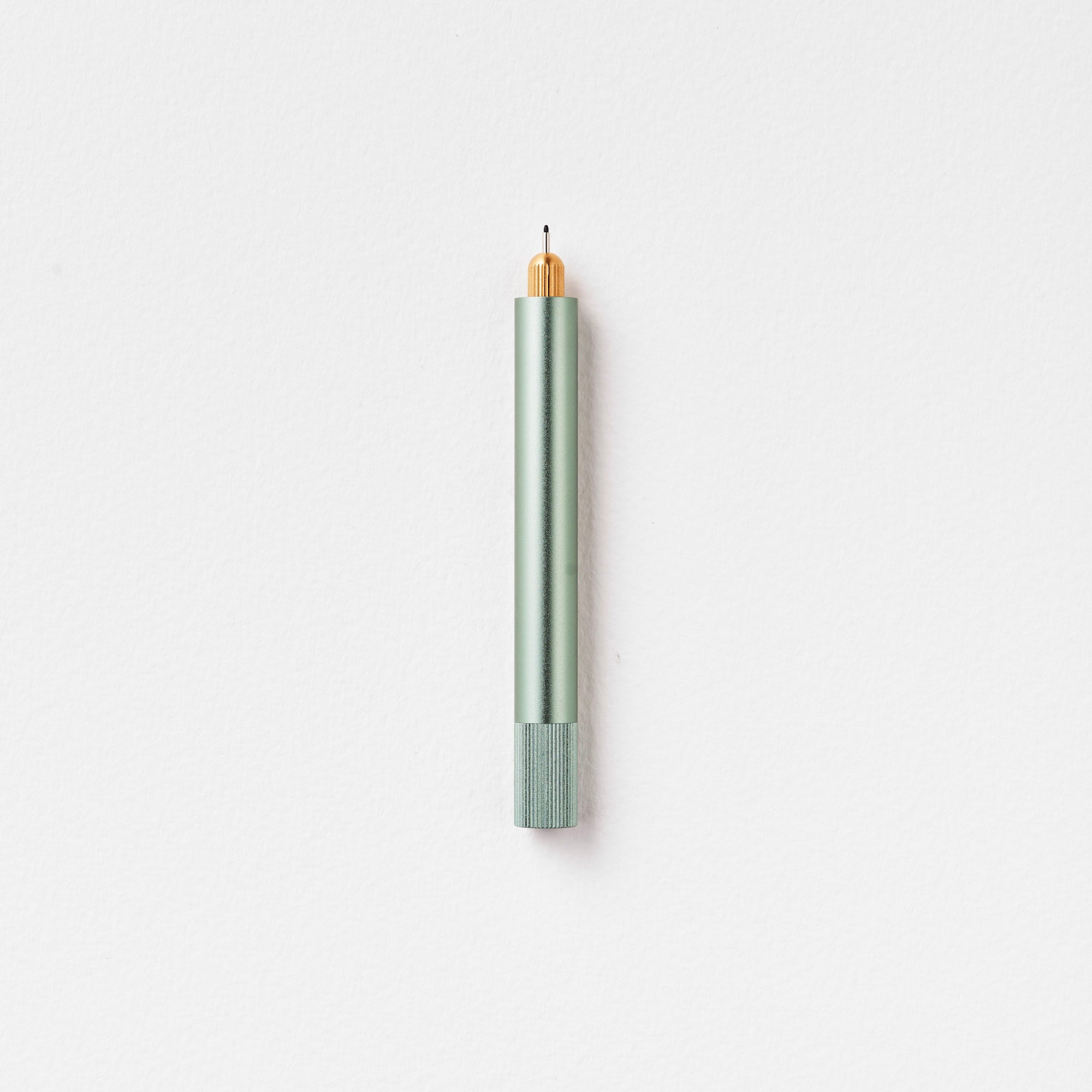 The Lumos Mini Refillable Pen in Sage on white background