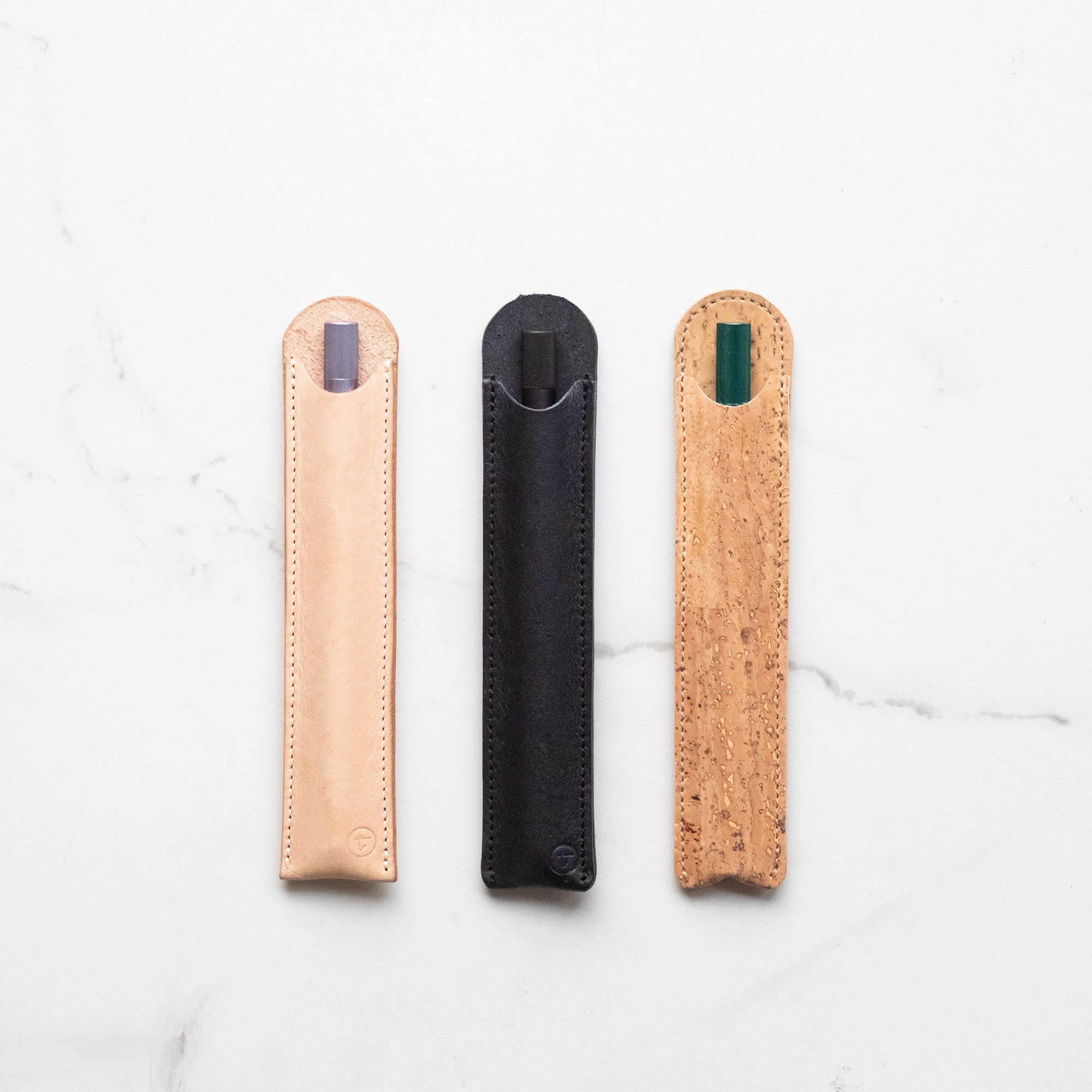 Leather Pen Sleeve for the Lumos Pro (left to right) Natural, Black and Cork