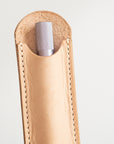 Detail shot of the leather Pen Sleeve for the Lumos Pro in Natural, with the Lumos Pro in Lilac