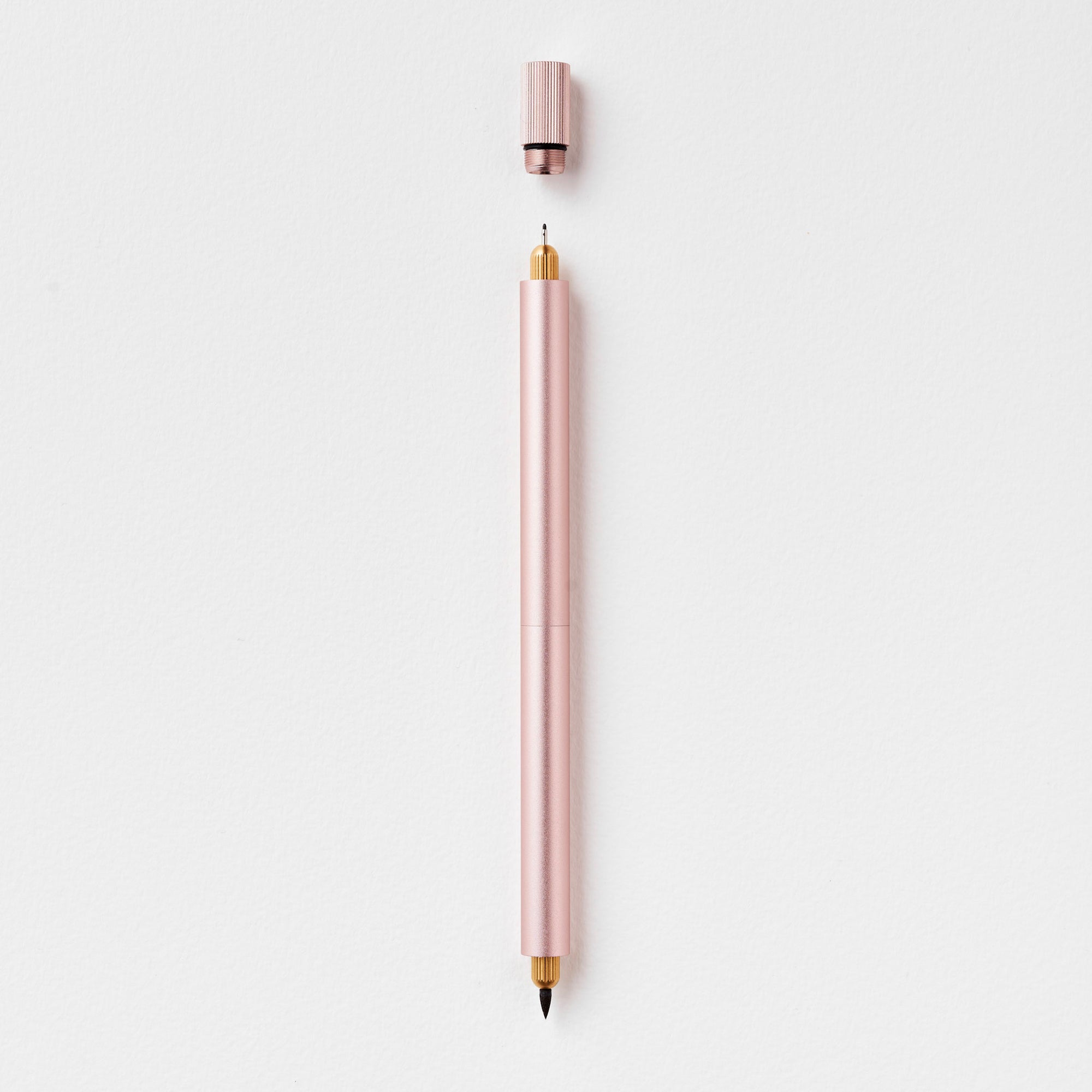 The Lumos Pro Duo Refillable Pen in Blush on white background