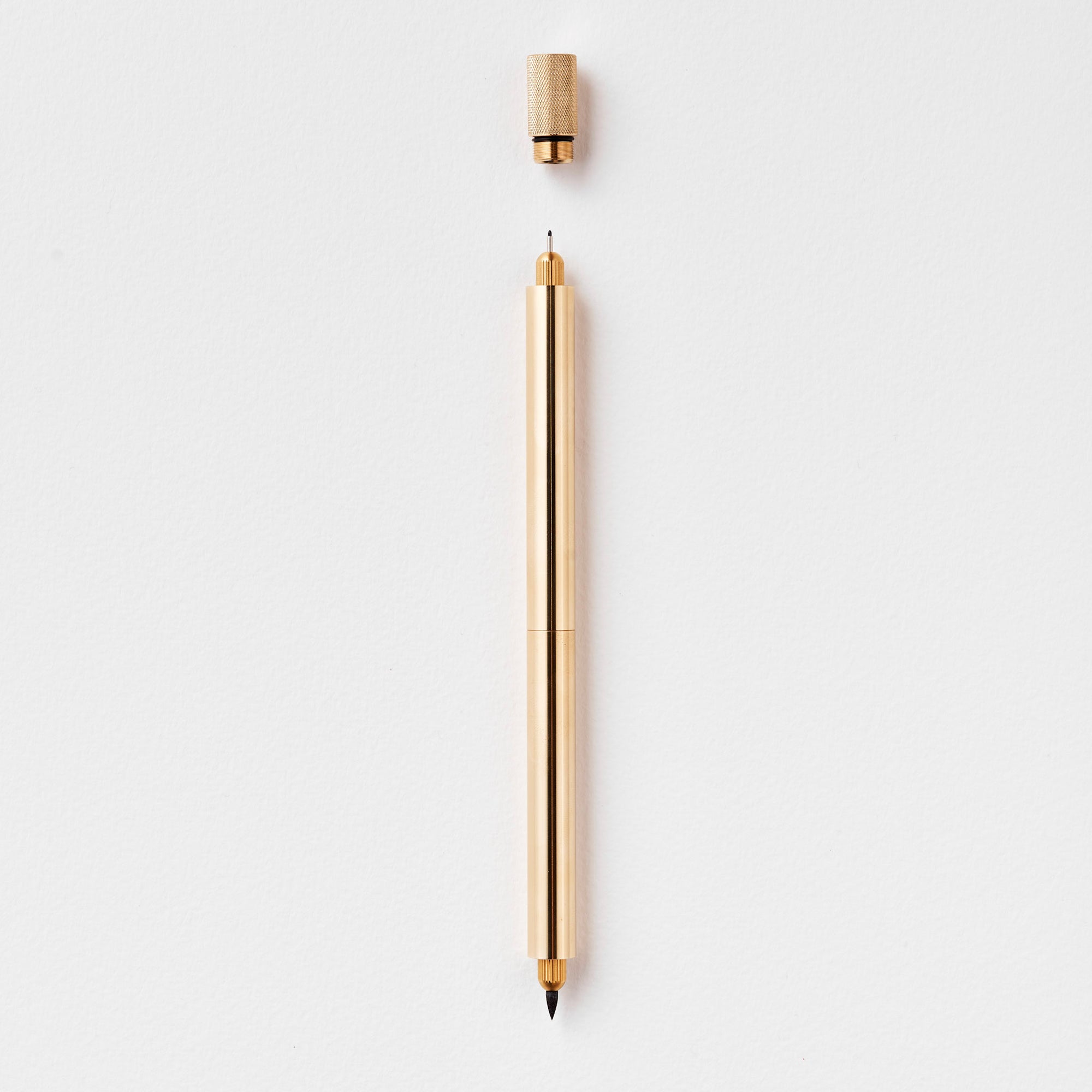 The Lumos Pro Duo Refillable Pen in Brass (Special Edition) on white background