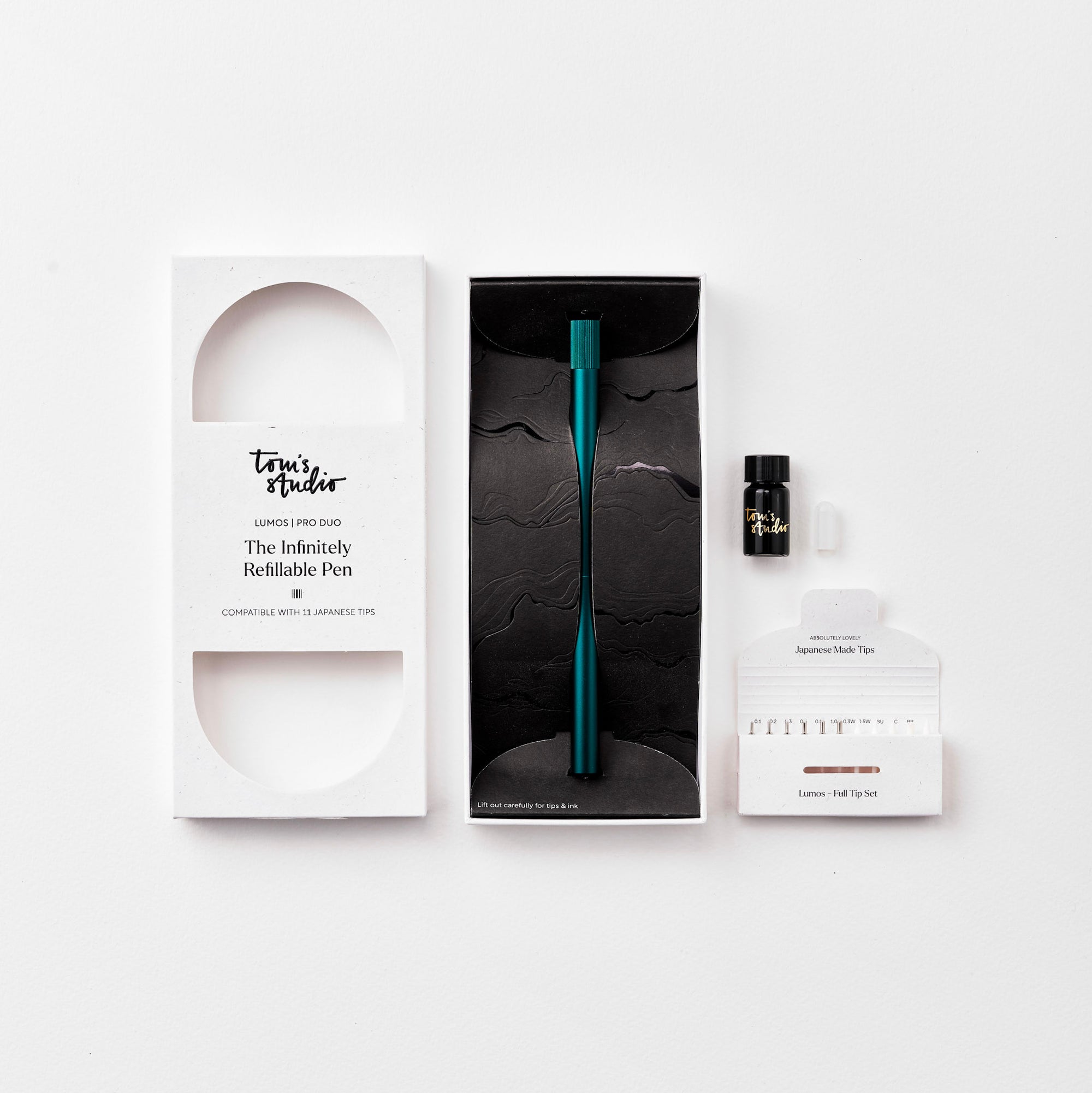 The Lumos Pro Duo Refillable Pen in Ivy with packaging on white background