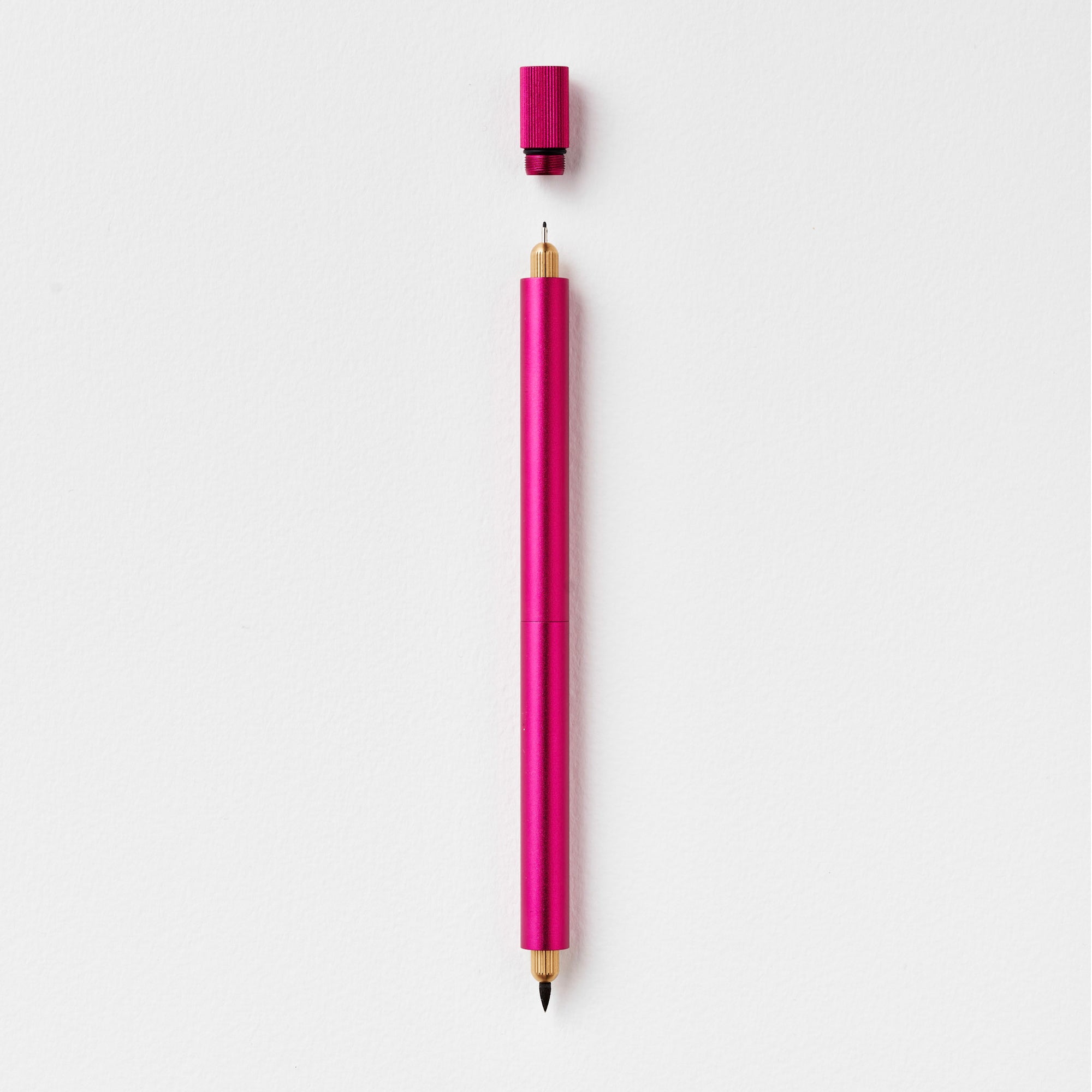 The Lumos Pro Duo Refillable Pen in Raspberry on white background