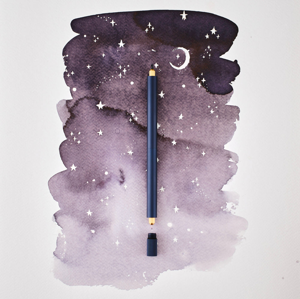 The Lumos Pro Duo Refillable Pen in Midnight on illustrative background
