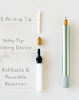 The Lumos Mini refillable pen in Sage shown with parts – writing tip, tip cover, tip holder and refillable reservoir