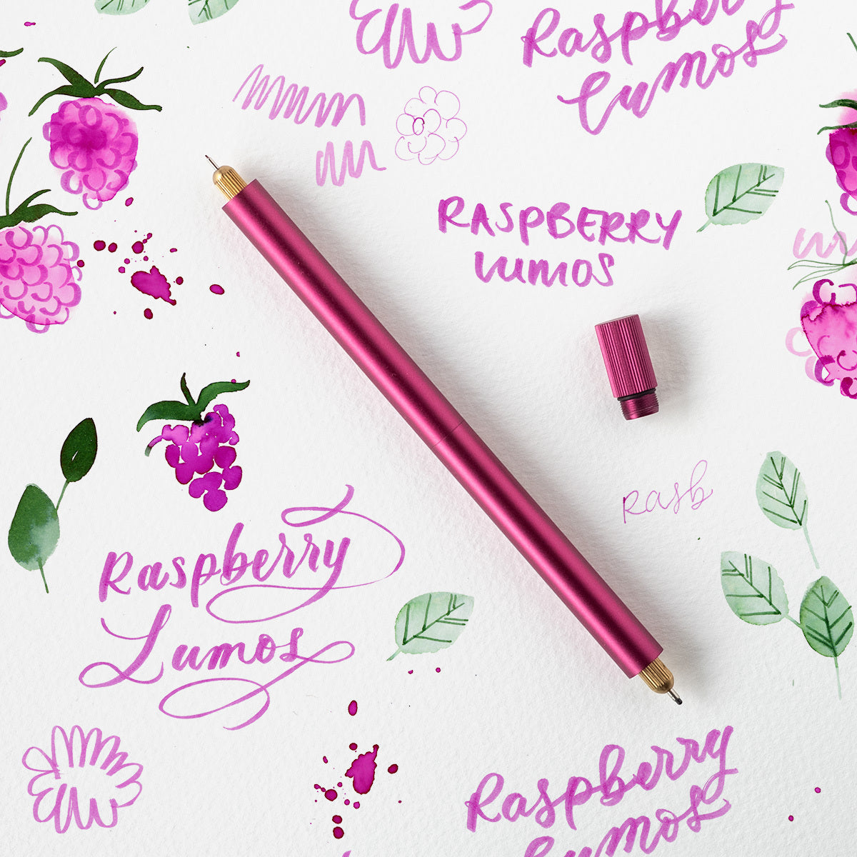 The Lumos Pro Duo Refillable Pen in Raspberry with fineliner and writing tips