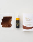 Tom's Studio Espresso Mini Fountain Pen Ink – featuring the packaging, bottle with pipette in lid and swatch