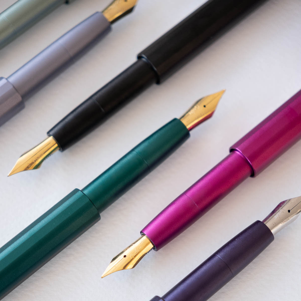 Detail shot of the Pocket Fountain Pen in a variety of colours and different fountain pen nibs