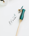 The Bloom calligraphy pen with blique nib setting in Ivy, in use