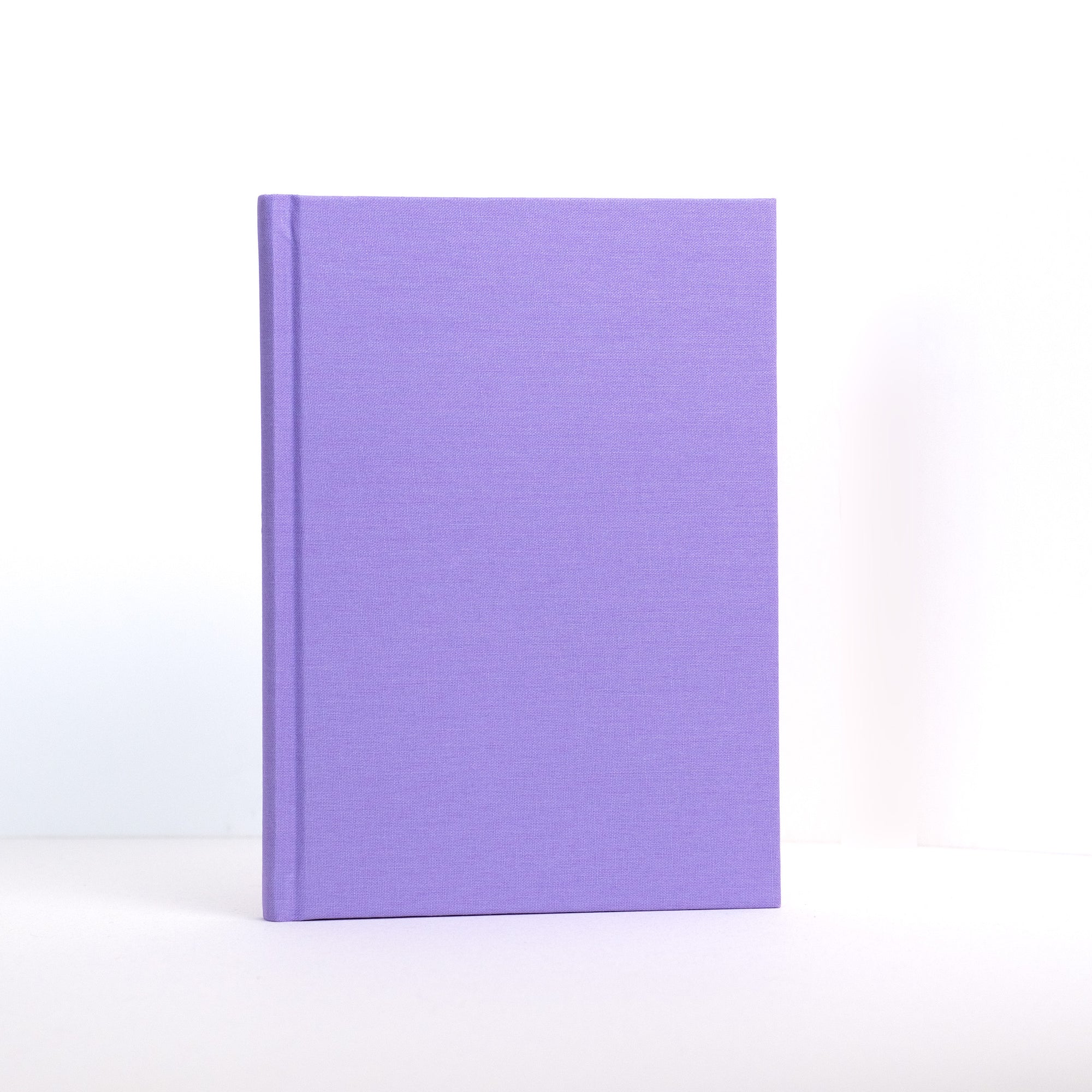 Semikolon A5 notebook in Lilac (purple) with premium linen bound cover.