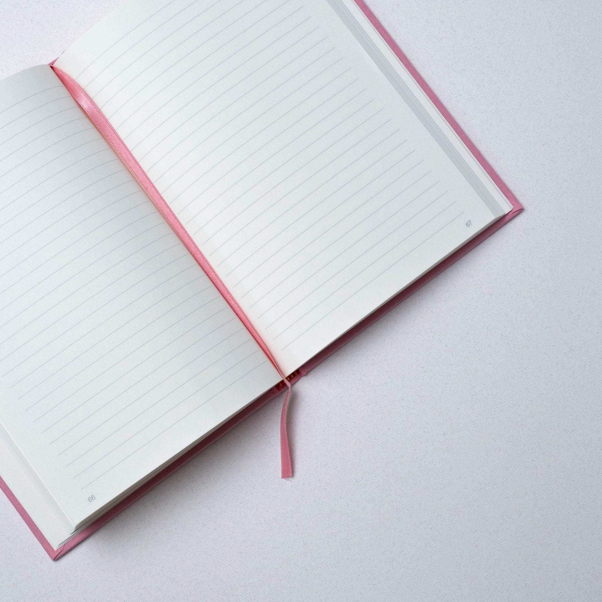 Semikolon A5 notebook in Flamingo pink with ruled pages, page marker ribbon and premium linen bound cover.