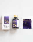 Tom's Studio Broadway Shimmer Fountain Pen Ink with two pens with inky goodness on paper with an ink swatch demonstrating the colour