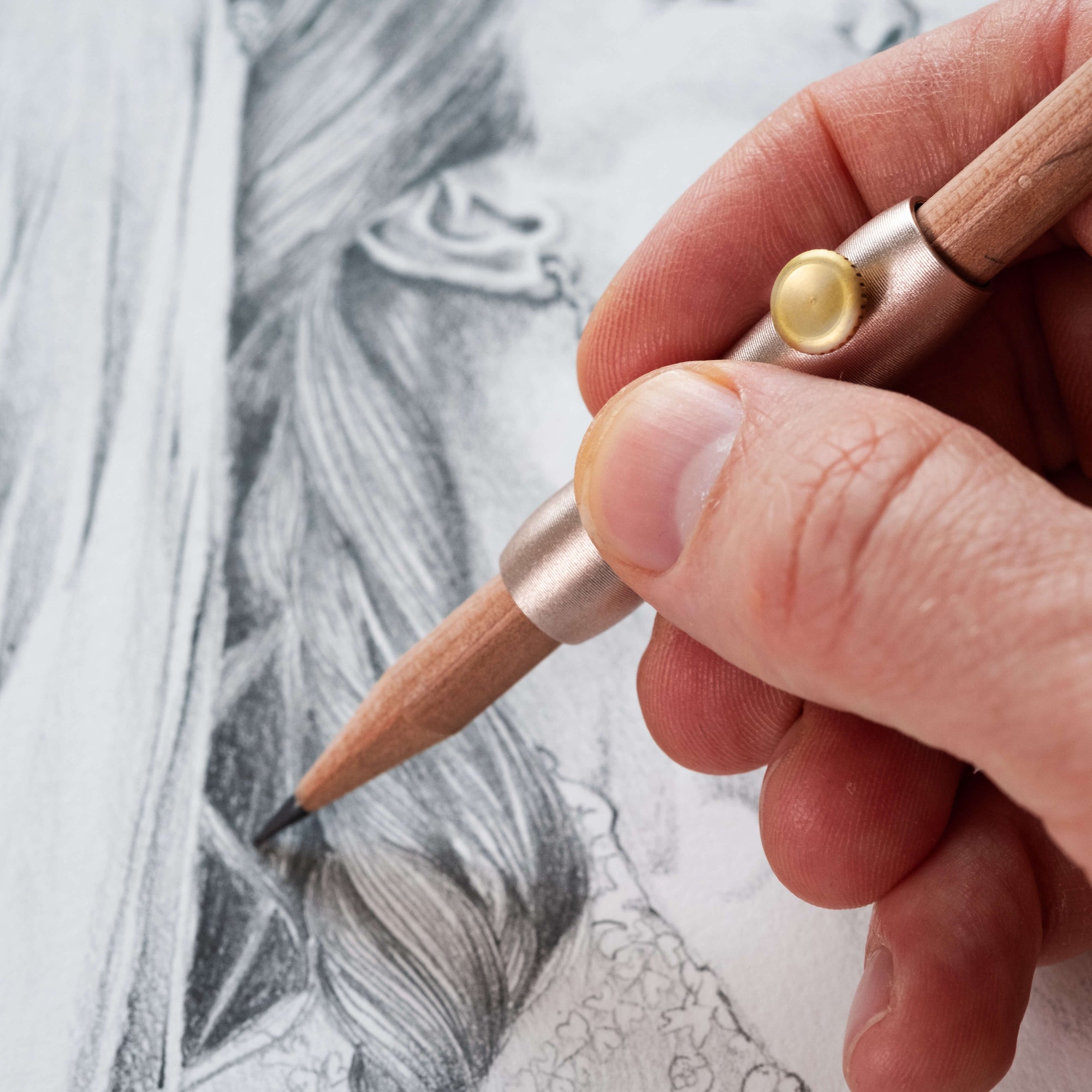 The Poise Pencil Grip Extender in Blush. Shown in use on a pencil illustration.