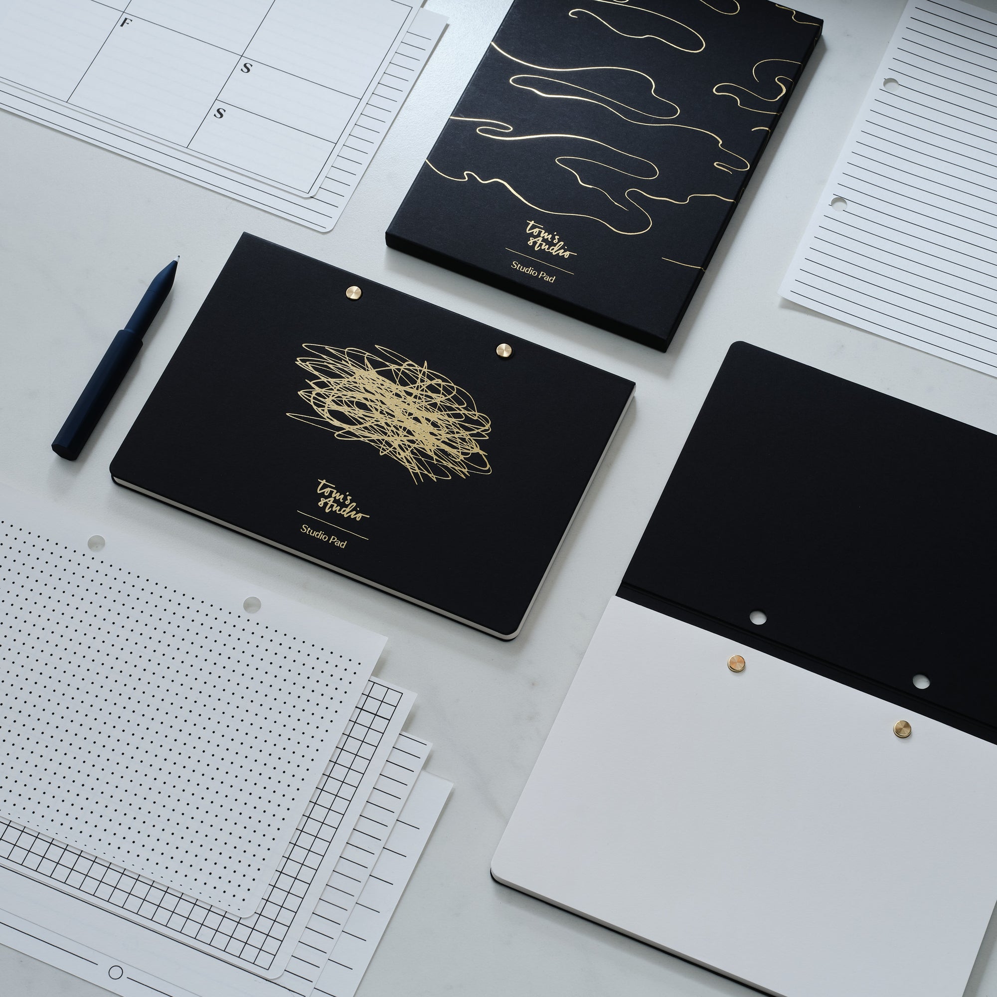 Cover for the Studio Pad refillable, customisable notebook and organiser in black with gold foil detail