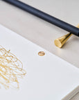 Detail shot of the solid brass studs in use in the Studio Pad refillable, customisable notebook and organiser