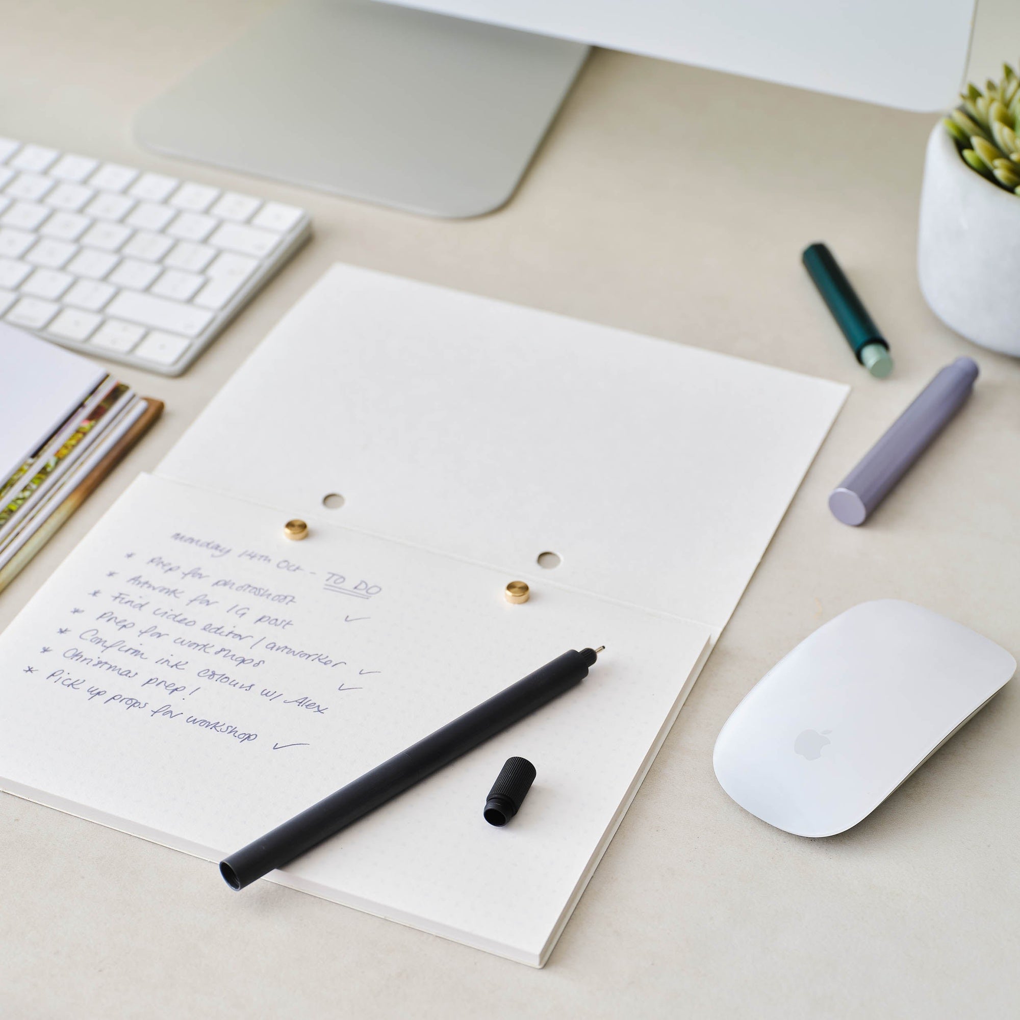 The Studio Pad refillable, customisable notebook and organiser shown open on a desk