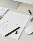 The Studio Pad refillable, customisable notebook and organiser shown open on a desk