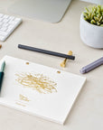 The Studio Pad refillable, customisable notebook and organiser pictured on a desk