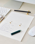 Detail shot of the Studio pad refillable, customisable notebook and organiser open on a desk