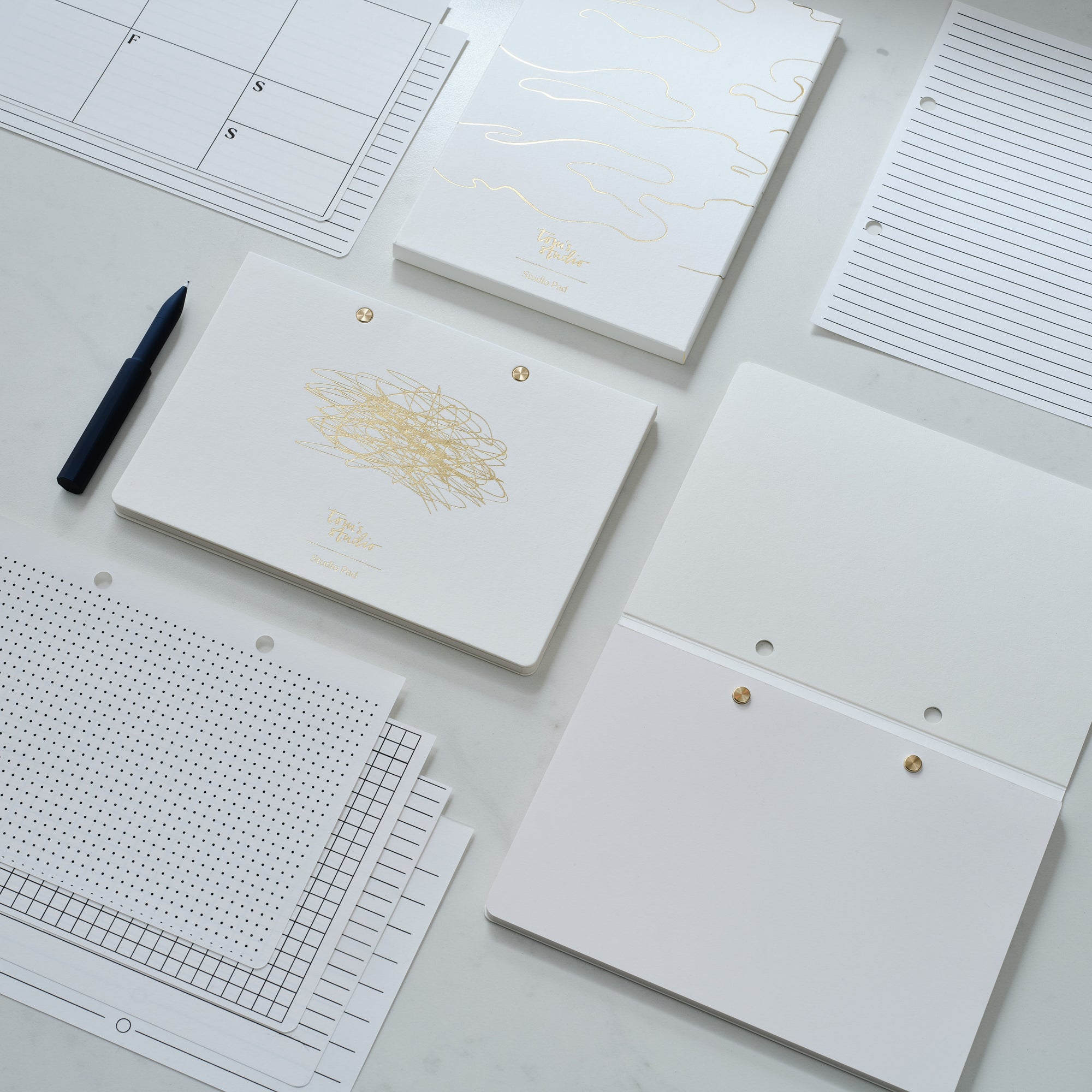 Cover for the Studio Pad refillable, customisable notebook and organiser in white with gold foil detail