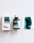 Tom's Studio Mallard Fountain Pen Ink with two pens with inky goodness on paper with an ink swatch demonstrating the colour