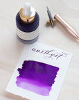 Amethyst - Calligraphy Ink in bottle with swatch showing the ink colour