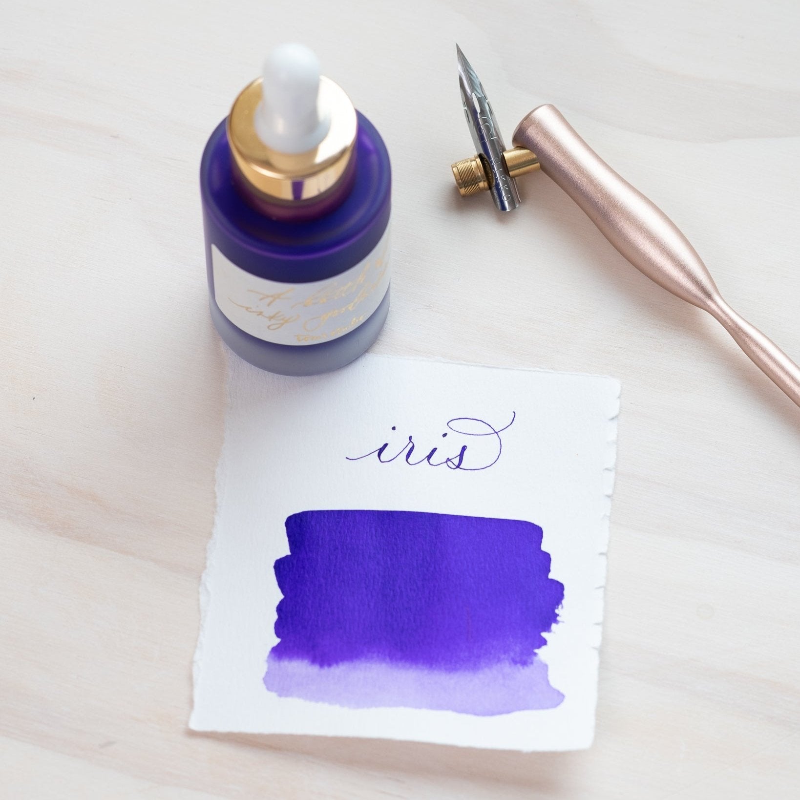 Iris - Calligraphy Ink in bottle with swatch showing the ink colour