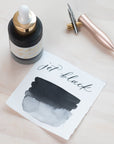 Jet Black - Calligraphy Ink in bottle with swatch showing the ink colour