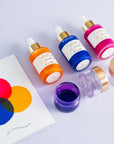 Contents of Mix Your Own Calligraphy Ink gift set including Sunflower, Ultra Marine and Hot Pink, and ink pots for colour mixing