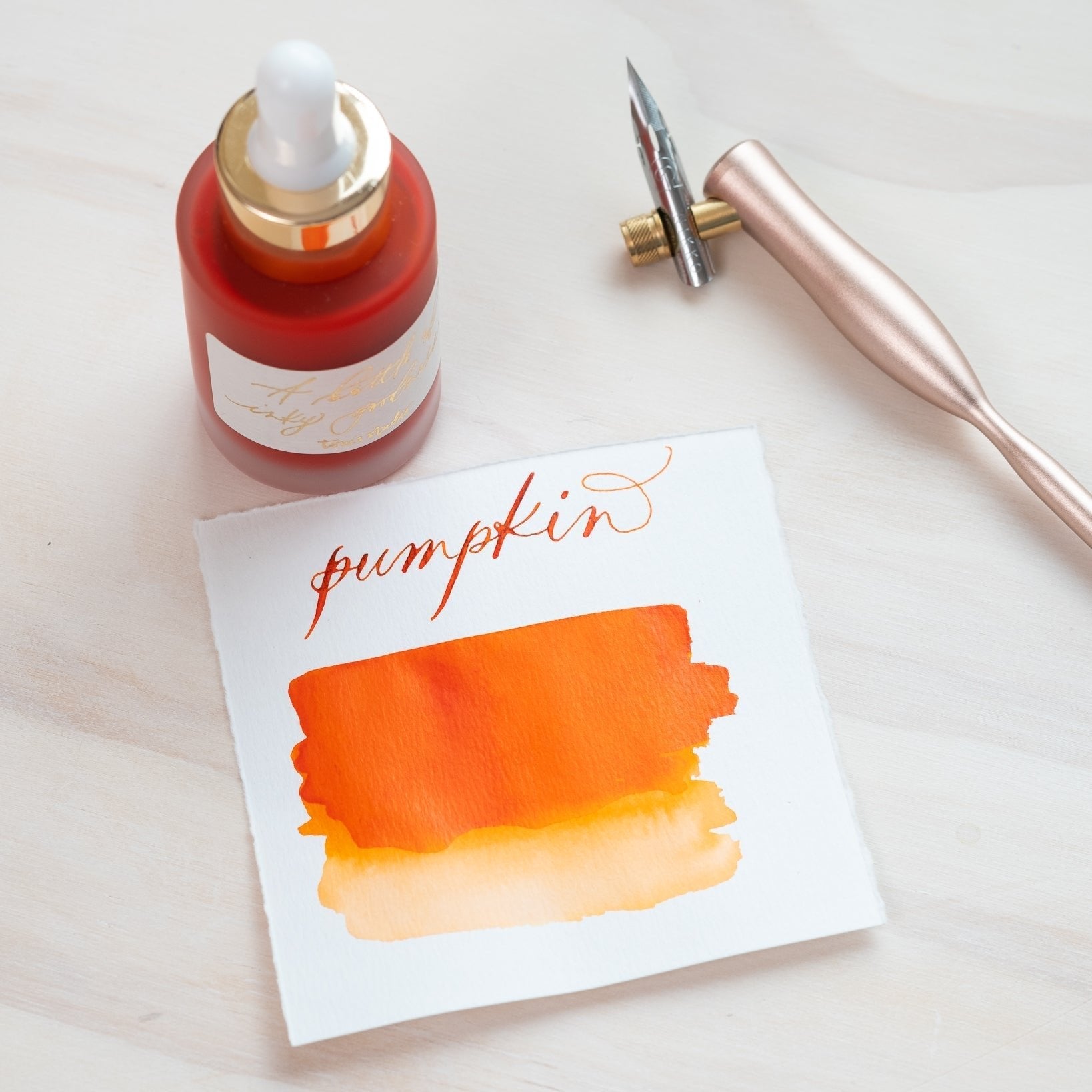 Pumpkin - Calligraphy Ink in bottle with swatch showing the ink colour