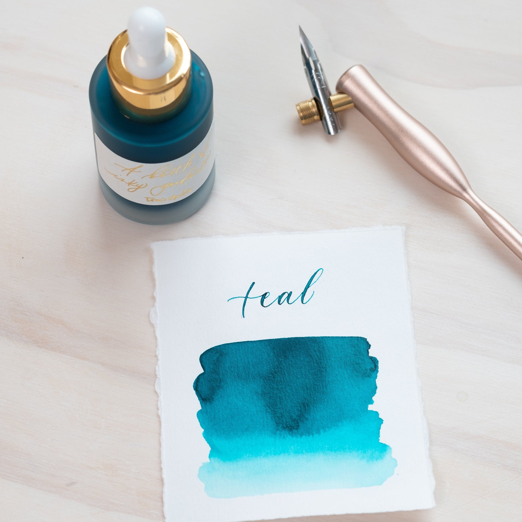 Teal - Calligraphy Ink in bottle with swatch showing the ink colour