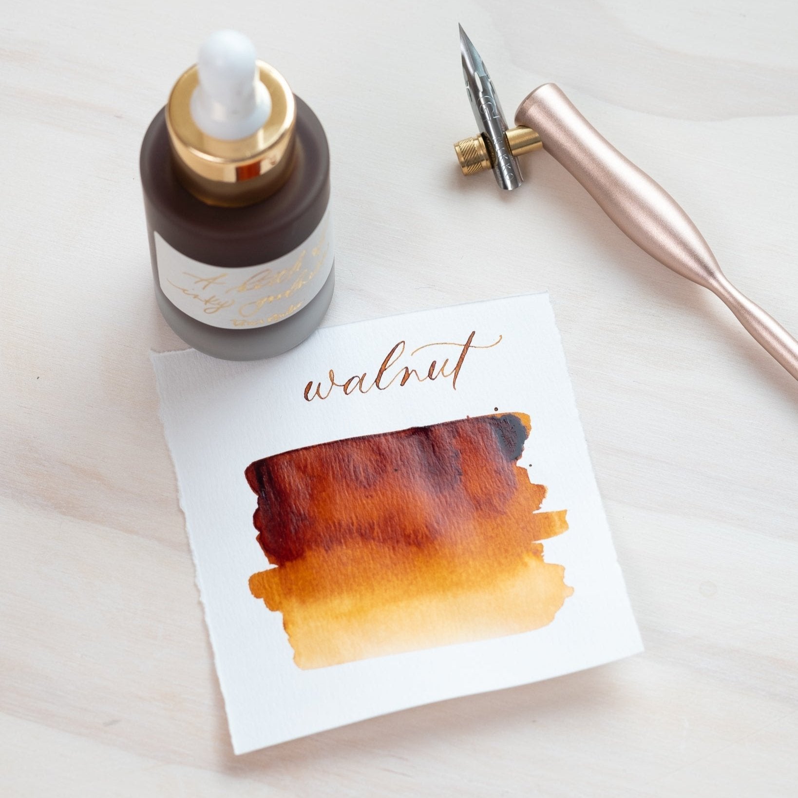 Walnut - Calligraphy Ink in bottle with swatch showing the ink colour