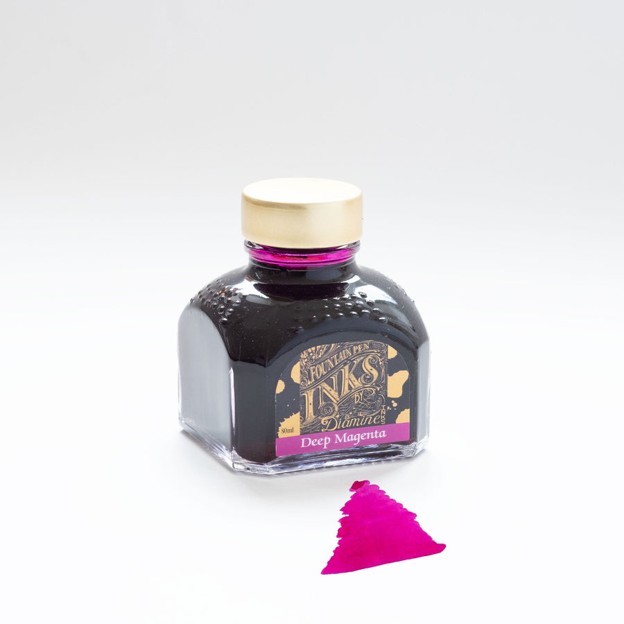 A bottle of Deep magenta fountain pen ink from Diamine on a white background