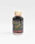 A bottle of Dragon blood shimmer fountain pen ink from Diamine on a white background