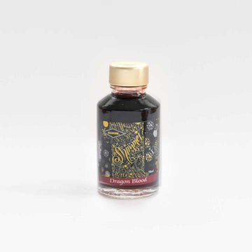 A bottle of Dragon blood shimmer fountain pen ink from Diamine on a white background