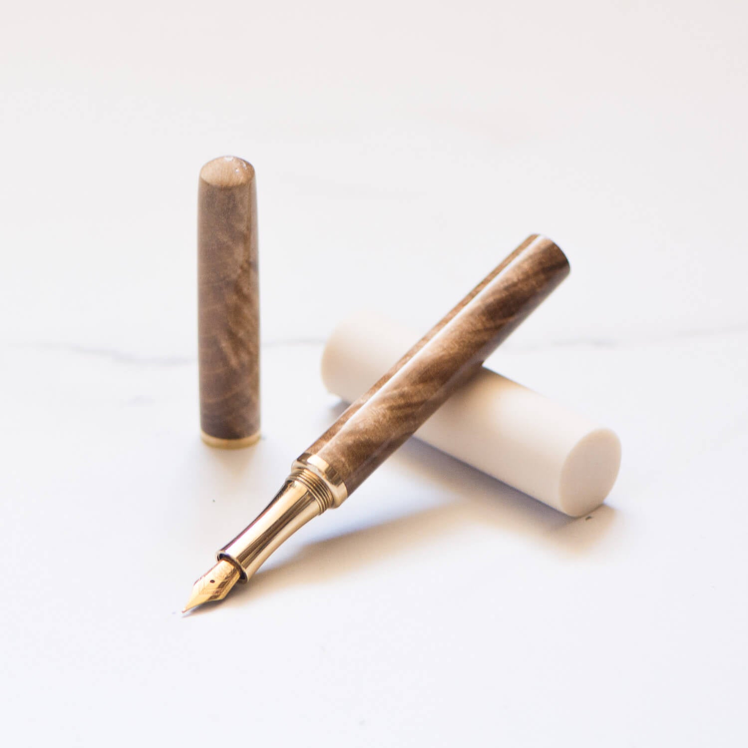 Feathered Walnut handmade Studio Pen with a brass grip