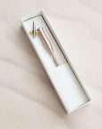 Flourish oblique calligraphy pen in rose gold fitted with a nikko g nib in a pen box