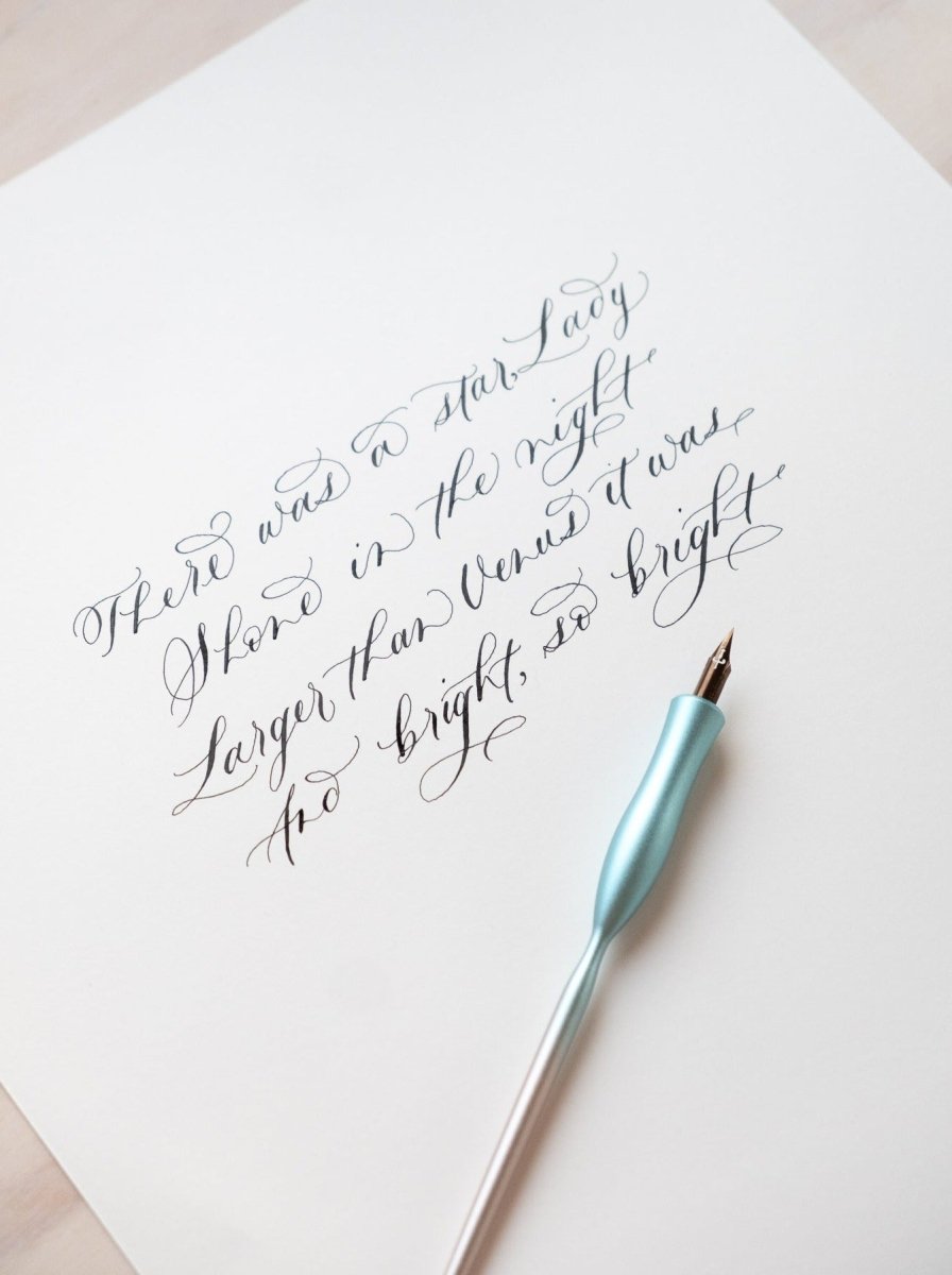 Flourish curve straight pen on paper with modern calligraphy