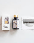Tom's Studio Dove Grey Fountain Pen Ink – featuring the packaging, bottle and a swatch on paper