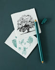 the lumos duo refillable fineliner in ivy with some botanical illustrations