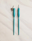 two calligraphy pens in bright teal finish one straight and one oblique